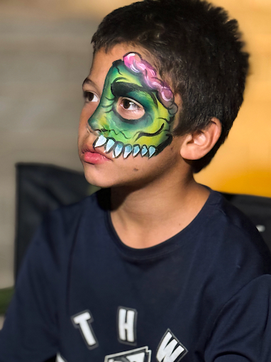 Green zombie face painting for Halloween