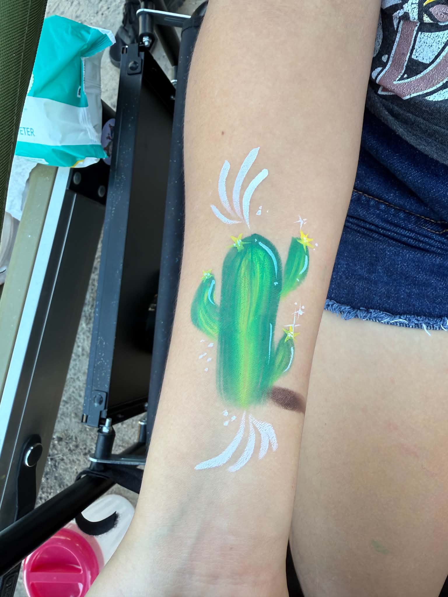 Colorful cactus arm painting created at a Tucson celebration